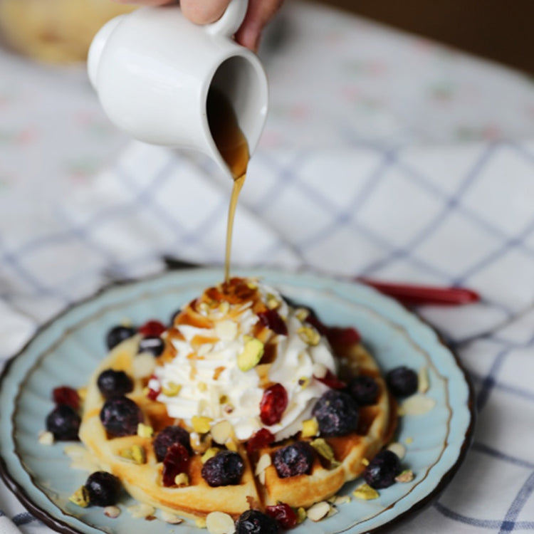 maple syrup waffle with berries and whipped cream