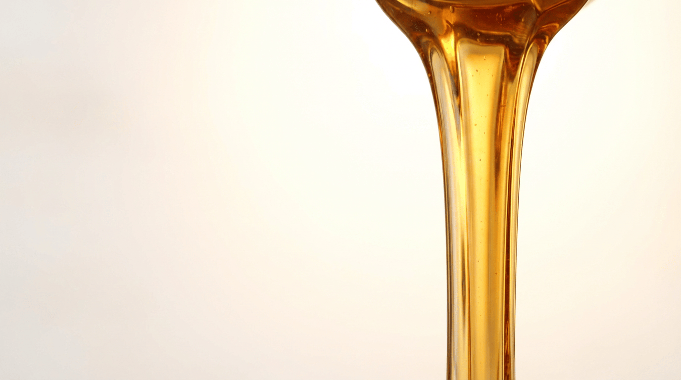 Pure maple syrup poured from a Maple Terroir bottle, single-origin Quebec